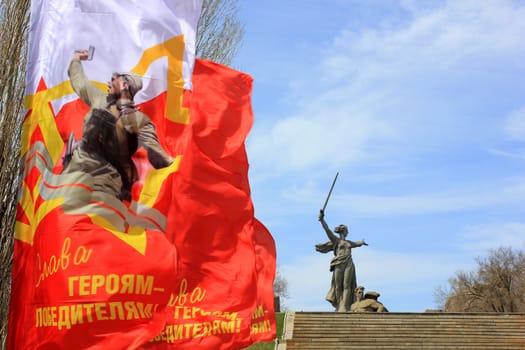 Festive flags with an inscription "Glory to conquering heroes!" on Mamayev Kurgan in Volgograd