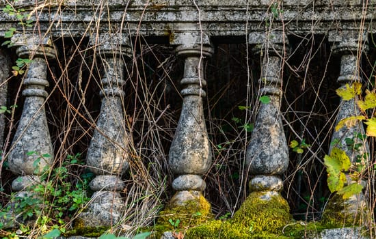 Old fashioned stone bannister and ancient columns