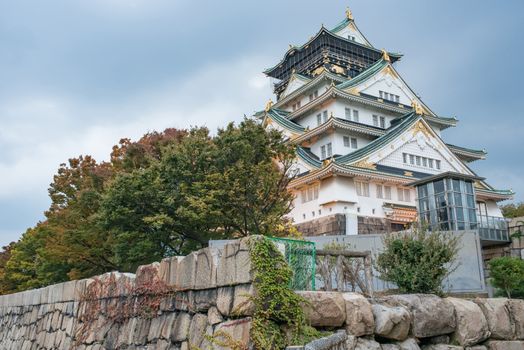 Osaka castle in cloudy sky before the rain fall down in Osaka, Japan.