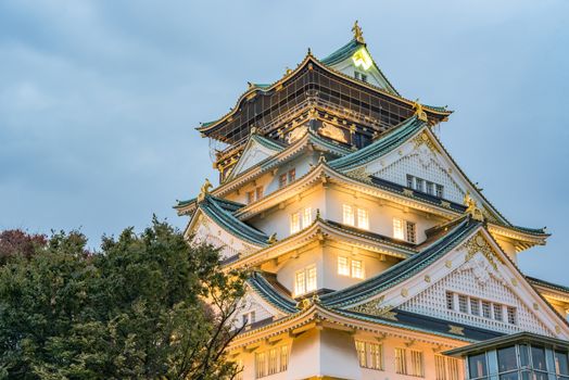 Osaka castle in cloudy sky before the rain fall down in Osaka, Japan.