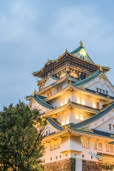 Osaka castle in cloudy sky before the rain fall down in Osaka, Japan.