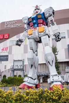 ODAIBA - TOKYO, JAPAN - November 9, 2015 : Statue of Gundam at DivercCity Tokyo Plaza in Tokyo. It is a full-size in ratio 1:1 of Gundam Statue Performances a the biggest Gundam in the world.