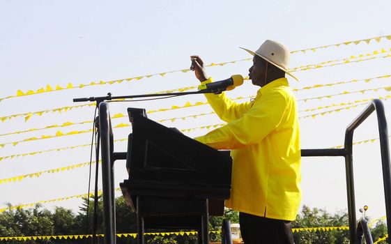 UGANDA, Kampala : Uganda's president Yoweri Museveni addresses supporters during a rally of the ruling National Resistance Movement (NRM) party at Kololo Airstrip in Kampala on February 16, 2016.Uganda's presidential contenders held their final campaign rallies on February 16, a day after opposition supporters clashed with police leaving at least one person dead. Museveni and his ruling National Resistance Movement (NRM) party is widely predicted to win a fifth term in power in polls, and warned at a rally against voting for his rivals. 