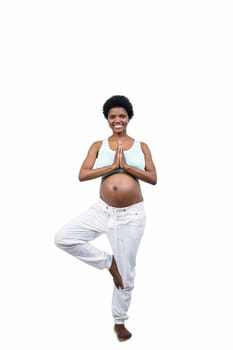 Pregnant woman doing yoga exercise on white background