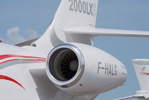 Singapore - February 14, 2016: Tail detail of the French, twin engine Dassault Falcon 2000LXS at Singapore Airshow at Changi Exhibition Centre in Singapore.