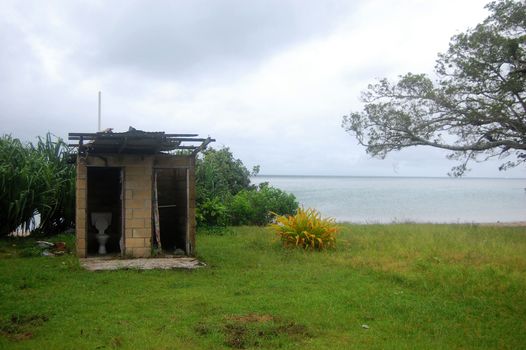 Abandoned toilet building at Pacific sea coast, Polynesia, Haapai Island, Tonga