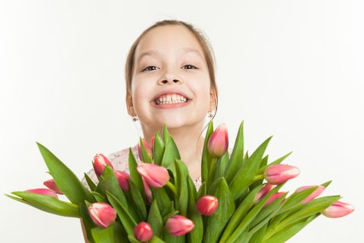 the beautiful girl gives a bouquet of tulips