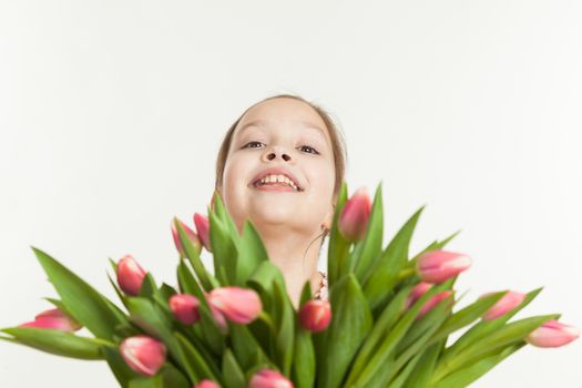 the beautiful girl gives a bouquet of tulips