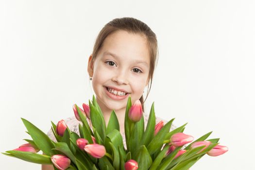 the beautiful girl gives a bouquet of tulips