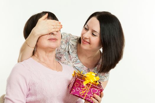 the woman gives to mother a gift