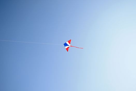 Kite flying in the wind and clear sky with copy space