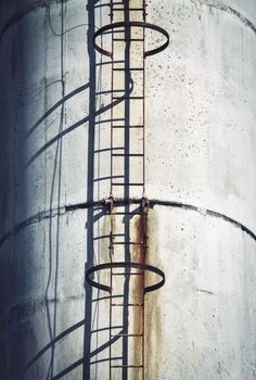 background industry chimney with a ladder