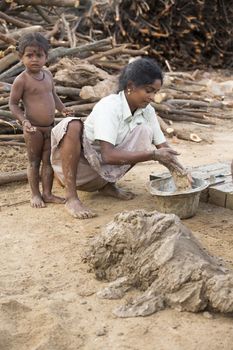 Asia India Tamil Nadu Sengal Soolai village. June 2014. All people of the village work 12 hours a day, 6 days per week, doing hand made bricks for buildings and house. They earn less than 50 dollars per month. Manufacturing of bricks from the beginning to the end (recover the clay, form, cook in the oven made by bricks,  dry in the sun)