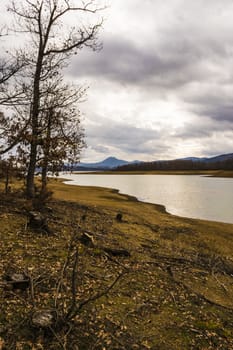 Plastiras lake view with dramatic cloudy sky, in central Greece