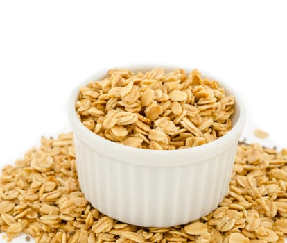 Homemade granola in white cup.