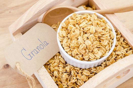 homemade healthy granola with granola paper tag on wooden background.