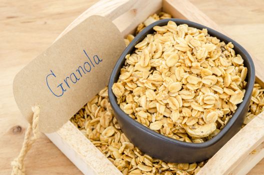 granola in bowl with granola paper tag.