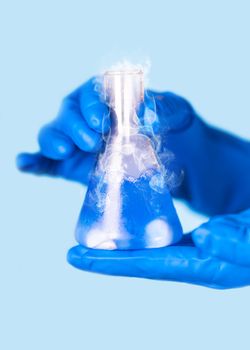 chemical reagent a test tube in the hands