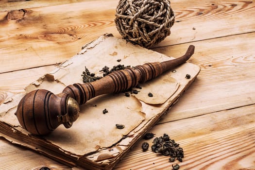 Smoking pipe in a retro style,dark chocolate on wooden background