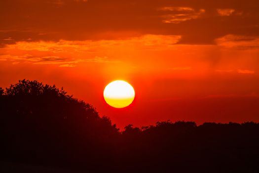 Evening glow, beautiful reddish color of the evening sky at the low sun.