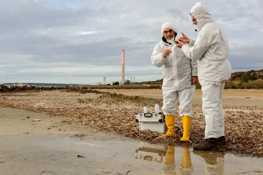 Experts analyze the water in a contaminated environment.