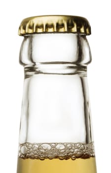 Beer bottle close up isolated on white with a bit of froth and golden cap