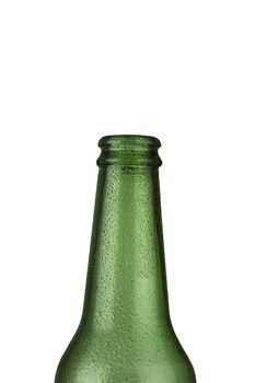 A green empty glass beer bottle with water droplets on it isolated on white background