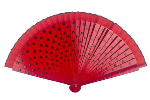 Open red fan with black dots isolated on white background