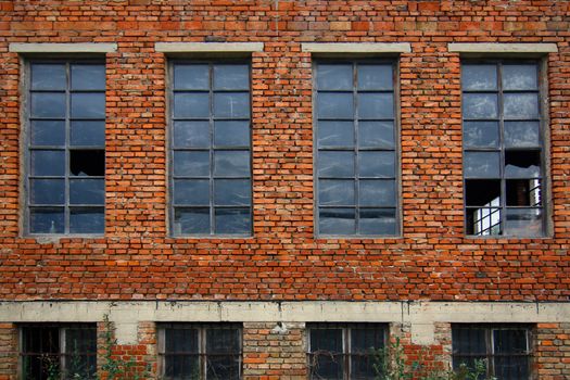 Image old brick wall with broken windows