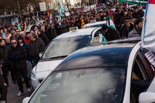 SPAIN, Madrid: Thousands of taxi drivers demonstrate against deregulation and ride-hailing companies such as Uber, in Madrid, on February 18, 2016.