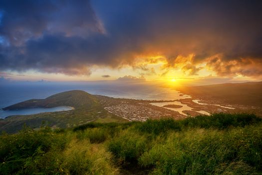 aerial view of Hanauma Bay and Diamond Head at sunset from a top of Koko Head Crater, Oahu, Hawaii, USA