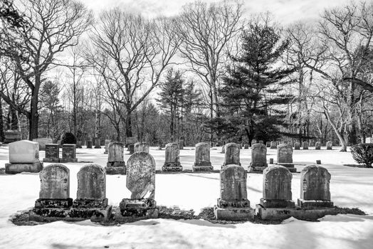 early american gravestones and cemetery  covered in snow