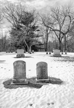 early american gravestones and cemetery  covered in snow