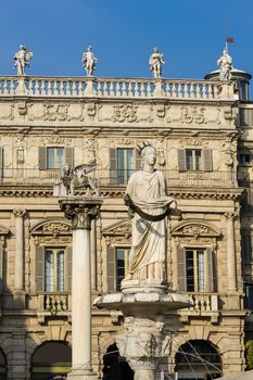 The ancient roman statue called Madonna Verona on a fountain in Piazza delle Erbe in Verona,