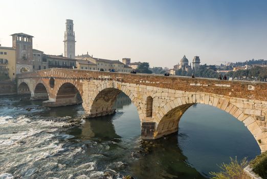 Ponte Pietra on river Adige, ancient roman bridge in the old town of Verona, Italy