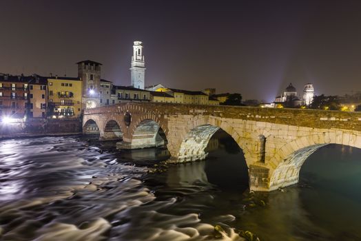 Ponte Pietra on river Adige, ancient roman bridge in the old town of Verona, Italy