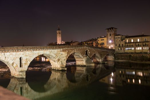 Ponte Pietra on river Adige, ancient roman bridge in the old town of Verona, Italy