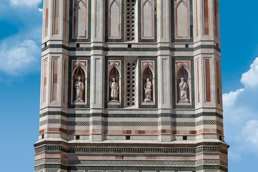 Close up detailed view of belfry of Santa Maria Del Fiore, famous Florence Duomo, with detailed sculptures of renaissance time.