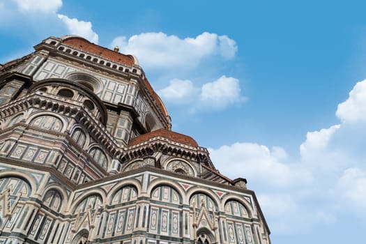 Close up detailed view of famous historical Florence Duomo, Santa Maria Del Fiore, on cloudy sky background.