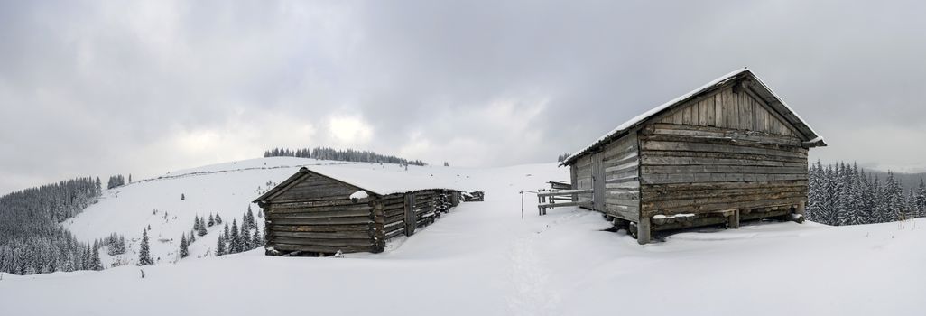 cabins in winter mountain in the evening