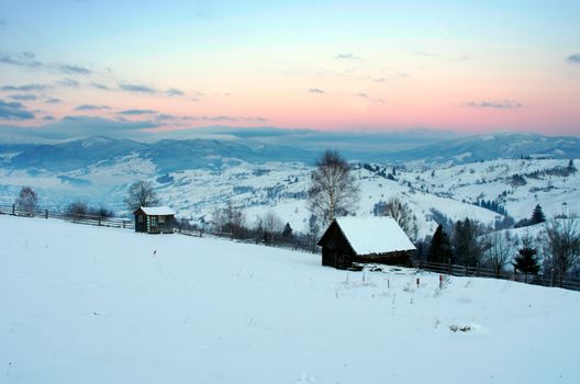 Carpathian mountain valley covered with fresh snow. Majestic landscape. Ukraine, Europe