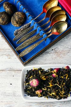 Aromatic teas and a set of spoons on a light background