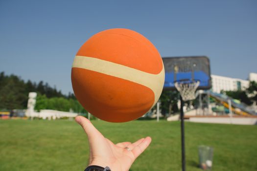 The basketball player about to shoot at summer day