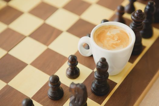 Leisure relax time or business strategy concept. Part of chess table with coffee cup hot drink 