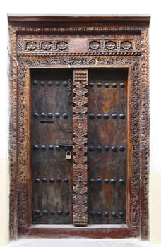 Old wooden door at Stone Town the capital of Zanzibar island East Africa.