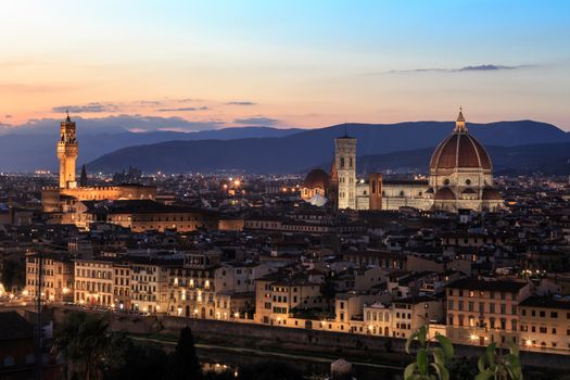 Top view of Florence city with old and historical buildings, on cloudy sunrise or sunset sky background.