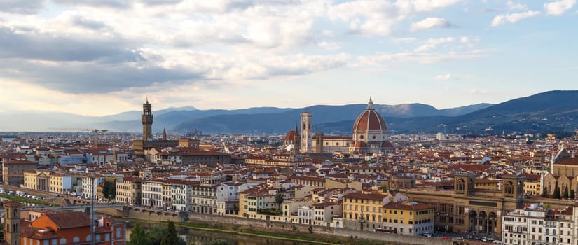 Top view of Florence city with old and historical buildings, on cloudy sunrise or sunset sky background.
