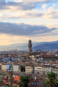 Top view of Florence city with old and historical buildings, on cloudy sunrise or sunset sky background.