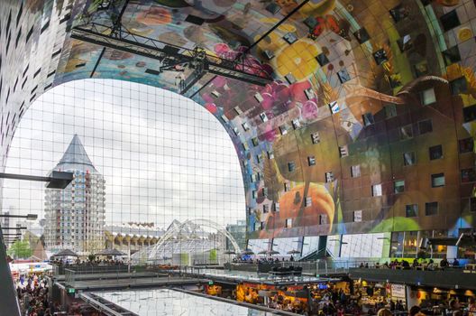 Rotterdam, Netherlands - May 9, 2015: People at Retail Shop in Markthal (Market hall) a new icon in Rotterdam. The covered food market and housing development shaped like a giant arch by Dutch architects MVRDV.