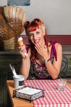View of a young woman inside a coffee shop having an ice cream.